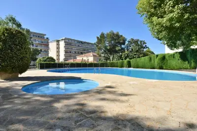 a swimming pool in the middle of a park at Résidence 3p Proche Centre Ville, Piscine Et Vue Mer - 3P proche centre ville, piscine et vue mer MAE-1673 in Cannes
