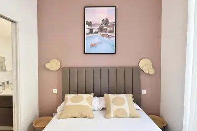 a bedroom with a bed and a swimming pool at Résidence 4p Moderne En Centre-ville, 5min Palais & Plages ! - 4P moderne en centre-ville, 5min Palais & plages ! MAE-1683 in Cannes