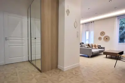a living room with a couch and a glass door at Résidence 4p Moderne En Centre-ville, 5min Palais & Plages ! - 4P moderne en centre-ville, 5min Palais & plages ! MAE-1683 in Cannes