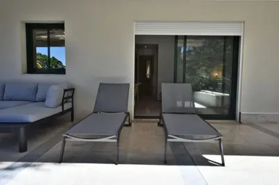 a living room with two chairs and a couch at Résidence 4p Avec Grande Terrasse Et Piscine - 4P avec grande terrasse et piscine MAE-1693 in Cannes