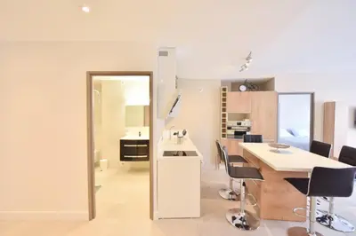 a kitchen and dining room with a table and chairs at Résidence 3p En Plein Cœur De Cannes, à 2min De La Croisette - 3P en plein cœur de Cannes, à 2min de la Croisette MAE-1703 in Cannes