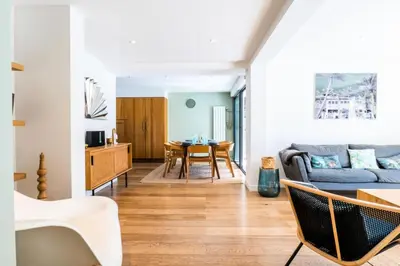 a living room with a couch and a table at Résidence Maison 10 Pers., Piscine, Proche Centre De Cannes - Maison 10 pers., piscine, proche centre de Cannes MAE-1773 in Cannes