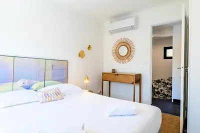 a bedroom with two white beds and a mirror at Résidence Maison 10 Pers., Piscine, Proche Centre De Cannes - Maison 10 pers., piscine, proche centre de Cannes MAE-1773 in Cannes