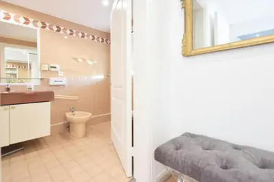 a bathroom with a sink and a toilet and a mirror at Résidence 3 Pièces En Résidence Avec Piscine Et Vue Mer - 3 Pièces en Résidence avec Piscine et Vue Mer MAE-1793 in Cannes