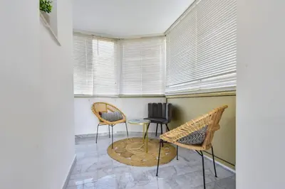 a room with two chairs and a table and a window at Résidence Cannes Palm Beach, 2 Min Des Plages - Cannes Palm beach, 2 min des plages MAE-1813 in Cannes