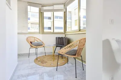 two chairs and a table in a room with windows at Résidence Cannes Palm Beach, 2 Min Des Plages - Cannes Palm beach, 2 min des plages MAE-1813 in Cannes