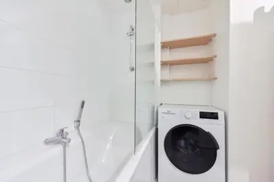 a bathroom with a washing machine and a shower at Résidence 3p Moderne En Centre Ville, à 1min De La Croisette - 3P moderne en centre ville, à 1min de la Croisette MAE-1843 in Cannes