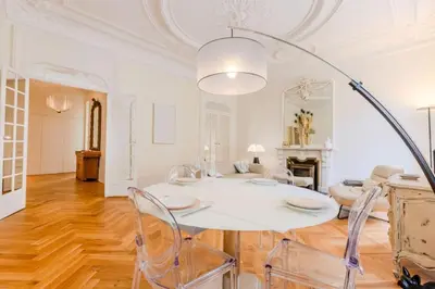 a white dining room with a white table and chairs at Résidence Hyper Centre Cannes - 4p à 100m Du Palais - Hyper centre Cannes - 4P à 100m du palais MAE-1873 in Cannes