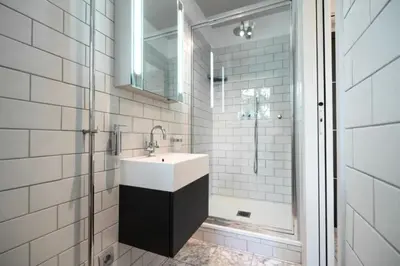 a white bathroom with a sink and a shower at Résidence 3p Pointe Croisette, Au Calme, Plages à Pied - 3P pointe Croisette, au calme, plages à pied MAE-1883 in Cannes
