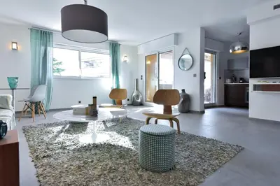 a living room with a couch and a table at Résidence 4 Pièces Refait à Neuf, 3 Min De La Croisette - 4 pièces refait à neuf, 3 min de la Croisette MAE-1893 in Cannes