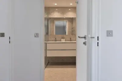 a bathroom with a sink and a mirror at Résidence 4 Pièces Refait à Neuf, 3 Min De La Croisette - 4 pièces refait à neuf, 3 min de la Croisette MAE-1893 in Cannes