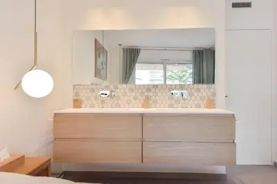 a bathroom with a sink and a mirror at Résidence 4 Pièces Refait à Neuf, 3 Min De La Croisette - 4 pièces refait à neuf, 3 min de la Croisette MAE-1893 in Cannes