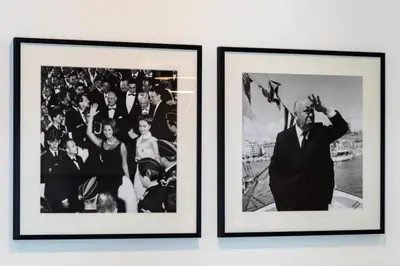 two framed photographs of a group of people on a wall at Résidence 3p Cosy, 1 Min Des Plages Et 3min Du Centre-ville - 3P Cosy, 1 min des plages et 3min du centre-ville MAE-1903 in Cannes