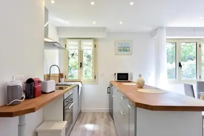 a kitchen with a wooden counter top in a room at Résidence 2p En Centre Ville à 2min à Pied De La Croisette - 2P en centre ville à 2min à pied de la Croisette MAE-1923 in Cannes