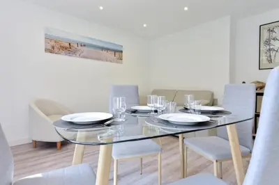 a dining room with a glass table and chairs at Résidence 2p En Centre Ville à 2min à Pied De La Croisette - 2P en centre ville à 2min à pied de la Croisette MAE-1923 in Cannes