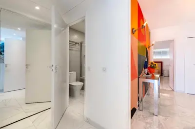 a bathroom with white walls and a toilet in it at Résidence 3p Résidence De Standing, Avec Vue Mer & Piscine - 3P résidence de standing, avec vue mer & piscine MAE-1933 in Cannes
