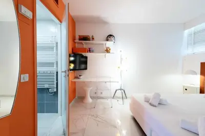 a small room with a bed and a desk at Résidence 3p Résidence De Standing, Avec Vue Mer & Piscine - 3P résidence de standing, avec vue mer & piscine MAE-1933 in Cannes