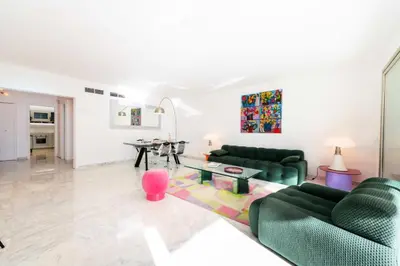 a living room with green couches and a table at Résidence 3p Résidence De Standing, Avec Vue Mer & Piscine - 3P résidence de standing, avec vue mer & piscine MAE-1933 in Cannes