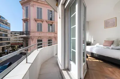 a bedroom with a bed on a balcony at Résidence 4p Carré D’or - Hyper Centre à Pied Des Plages - 4P Carré d’or - Hyper centre à pied des plages MAE-1973 in Cannes