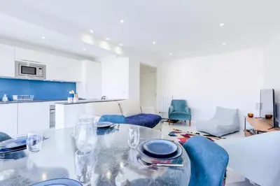 a kitchen and living room with a table and chairs at Résidence 2 Pièces Cozy à 5 Minutes à Pied De La Croisette - 2 pièces cozy à 5 minutes à pied de la Croisette MAE-1983 in Cannes