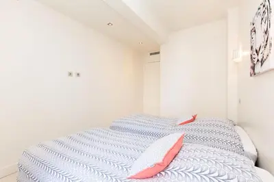 a bedroom with a bed with two pillows on it at Résidence 3p Moderne Et Cosy Aux Pieds De La Croisette ! - 3P moderne et cosy aux pieds de la Croisette ! MAE-2003 in Cannes