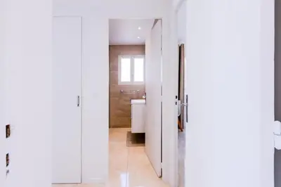 a bathroom with a white door and a toilet at Résidence 3p De Style Avec Balcon à 3 Min De La Croisette - 3P de style avec balcon à 3 min de la Croisette MAE-2013 in Cannes