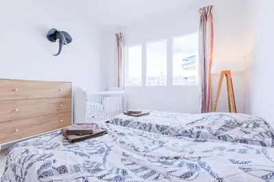 a bedroom with a bed and a window at Résidence 3p De Style Avec Balcon à 3 Min De La Croisette - 3P de style avec balcon à 3 min de la Croisette MAE-2013 in Cannes