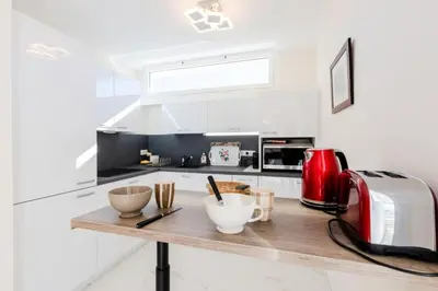 a kitchen with a counter with a toaster and bowls on it at Résidence 2p De Style Avec Terrasse, Domaine Privé Palm Beach - 2P de style avec terrasse, domaine privé Palm Beach MAE-2053 in Cannes