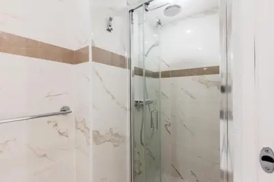 a shower with a glass door in a bathroom at Résidence 2p De Style Avec Terrasse, Domaine Privé Palm Beach - 2P de style avec terrasse, domaine privé Palm Beach MAE-2053 in Cannes