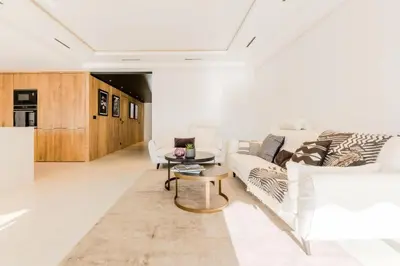 a living room with a white couch and a table at Résidence 4p De 96m² Sur Les Hauteurs De Cannes - 4P de 96m² sur les hauteurs de Cannes MAE-2083 in Cannes