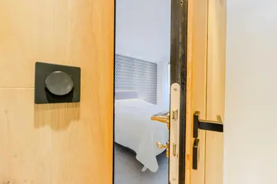 a door open to a room with a bed at Résidence 4p De 96m² Sur Les Hauteurs De Cannes - 4P de 96m² sur les hauteurs de Cannes MAE-2083 in Cannes