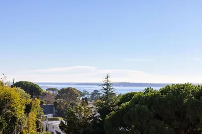 a view of the ocean from a hill at Résidence 4p De 96m² Sur Les Hauteurs De Cannes - 4P de 96m² sur les hauteurs de Cannes MAE-2083 in Cannes