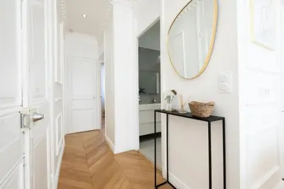 a hallway with a mirror and a console table at Résidence 4p Au Cœur Du Centre Ville - 5 Min Palais & Plages - 4P au cœur du centre ville - 5 min Palais & Plages MAE-2093 in Cannes