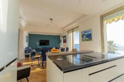 a kitchen with a large island with a glass counter top at Résidence 4p Vue Mer Exceptionnelle, Aux Pieds Des Plages - 4P vue mer exceptionnelle, aux pieds des plages MAE-2113 in Cannes