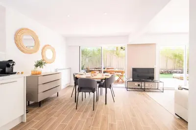 a kitchen and dining room with a table and chairs at Résidence 3p Avec Jardin Près De La Croisette - 3p avec jardin près de la Croisette MAE-2173 in Cannes