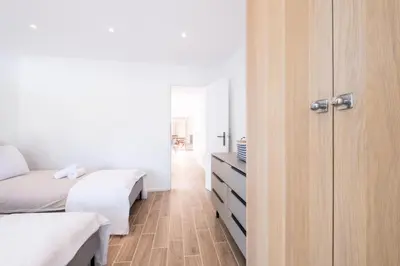 a bedroom with two beds and a closet at Résidence 3p Avec Jardin Près De La Croisette - 3p avec jardin près de la Croisette MAE-2173 in Cannes
