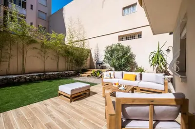 a patio with two couches and a lawn at Résidence 3p Avec Jardin Près De La Croisette - 3p avec jardin près de la Croisette MAE-2173 in Cannes