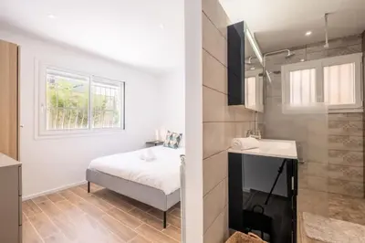 a bedroom with a bed and a sink in a room at Résidence 3p Avec Jardin Près De La Croisette - 3p avec jardin près de la Croisette MAE-2173 in Cannes