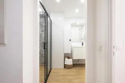 a white bathroom with a glass shower backdoor at Résidence Appartement Avec Piscine Résidentiel - Appartement avec piscine résidentiel MAE-2183 in Cannes