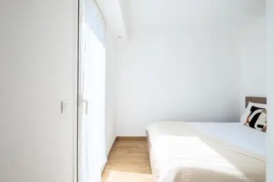 a bedroom with a bed and a mirror at Résidence Appartement Avec Piscine Résidentiel - Appartement avec piscine résidentiel MAE-2183 in Cannes