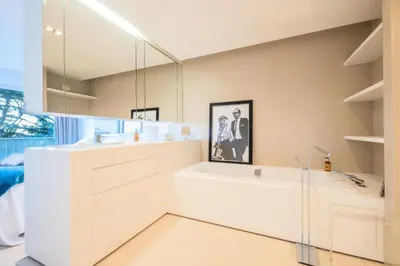 a white bathroom with a sink and a mirror at Résidence 3p, Terrasse Aménagée, Piscine, Vue Sur Les îles - 3P, terrasse aménagée, piscine, vue sur les îles MAE-2193 in Cannes