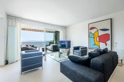 a living room with two couches and a television at Résidence 3p, Terrasse Aménagée, Piscine, Vue Sur Les îles - 3P, terrasse aménagée, piscine, vue sur les îles MAE-2193 in Cannes