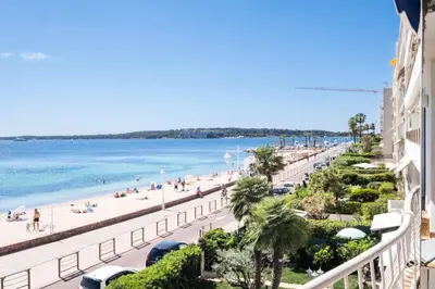 a view of the beach from the balcony of a building at Résidence Rare ! 3p En Front De Mer - RARE ! 3P en front de mer MAE-2213 in Cannes