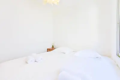 two white beds in a bedroom with a window at Résidence 2p Hyper Centre Cannes, 100 Plages - 2P hyper centre Cannes, 100 plages MAE-2223 in Cannes