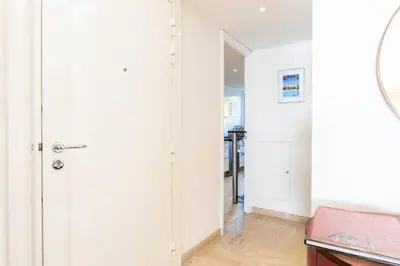 a hallway with a door leading to a kitchen at Résidence 3p Haut De Gamme En Résidence Avec Piscine ! - 3P haut de gamme en résidence avec piscine ! MAE-2253 in Cannes