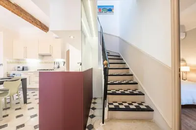 a staircase leading up to the kitchen in a house at Résidence Superbe Villa Avec Piscine & Sauna - Superbe villa avec piscine & sauna MAE-2283 in Cannes