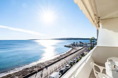 a balcony with a view of the beach and the ocean at Résidence Vue Mer Panoramique - 3 Pièces Mouré Rouge - VUE MER PANORAMIQUE - 3 pièces Mouré Rouge MAE-2293 in Cannes