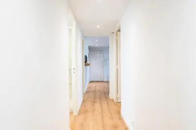 an empty hallway with white walls and wood floors at Résidence 4p De Style à Deux Pas Du Palais Des Festivals - 4P de style à deux pas du Palais des festivals MAE-2303 in Cannes