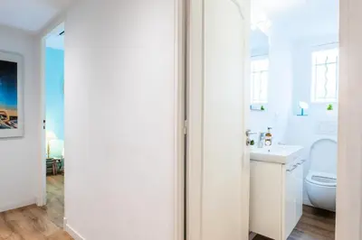 a white bathroom with a toilet and a sink at Résidence 4p De Style à Deux Pas Du Palais Des Festivals - 4P de style à deux pas du Palais des festivals MAE-2303 in Cannes