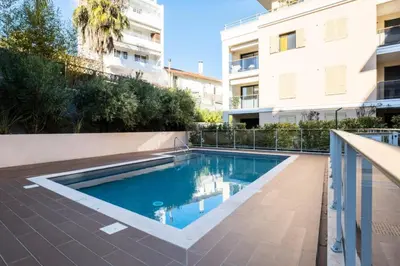 a swimming pool in front of a building at Résidence 2p Avec Piscine Au Palm Beach - 2P avec piscine au Palm Beach MAE-2313 in Cannes